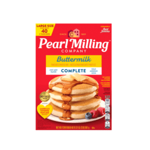 Pearl Milling Company Buttermilk Complete pancake mix box with a stack of syrup-covered pancakes on a plate.